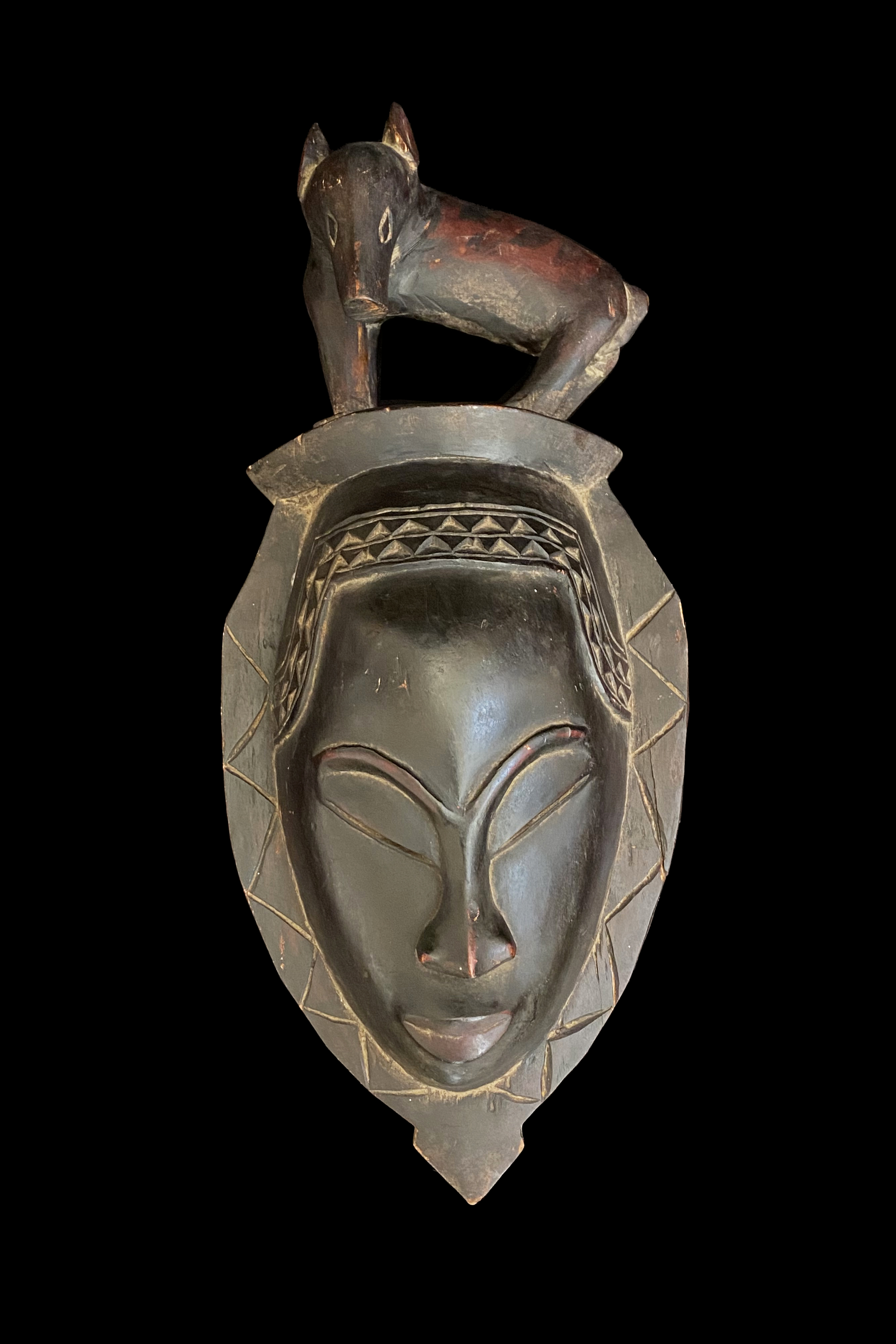 Mask surmounted by an Animal - Guro People, Ivory Coast
