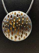 Circular Pierced Oxidized Sterling Silver Disc with a Gold Vermeil Backplate (BAS65E) 1
